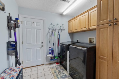 Discover this stunning brick home on just under half an acre on Carolina Shores Golf Course in North Carolina - for sale on GolfHomes.com, golf home, golf lot