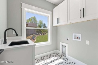 Discover refined living in this all-brick, custom new build in on Toqua Golf Course - Loudon County in Tennessee - for sale on GolfHomes.com, golf home, golf lot