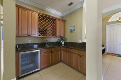 Welcome to this stunning estate home nestled within a premier on Hammock Creek Golf Club in Florida - for sale on GolfHomes.com, golf home, golf lot