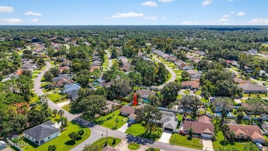 **3.75 ASSUMABLE MORTGAGE** This move-in-ready Palm Coast home on The Grand Club - Pine Lakes Course in Florida - for sale on GolfHomes.com, golf home, golf lot