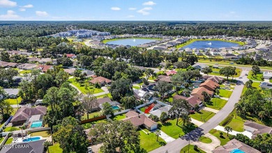 **3.75 ASSUMABLE MORTGAGE** This move-in-ready Palm Coast home on The Grand Club - Pine Lakes Course in Florida - for sale on GolfHomes.com, golf home, golf lot