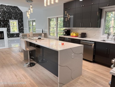 Discover this ultra modern, newly renovated 4-bedroom, 2.5 bath on Country Club of the Poconos Golf Course in Pennsylvania - for sale on GolfHomes.com, golf home, golf lot