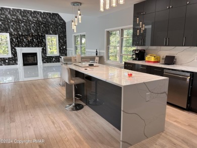 Discover this ultra modern, newly renovated 4-bedroom, 2.5 bath on Country Club of the Poconos Golf Course in Pennsylvania - for sale on GolfHomes.com, golf home, golf lot