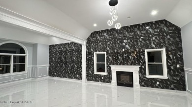 Discover this ultra modern, newly renovated 4-bedroom, 2.5 bath on Country Club of the Poconos Golf Course in Pennsylvania - for sale on GolfHomes.com, golf home, golf lot