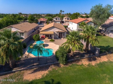 This charming home, situated on the 11th tee box of the on Greenfield Lakes Golf Club in Arizona - for sale on GolfHomes.com, golf home, golf lot