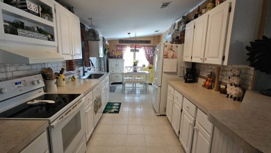 Welcome to this spacious 3-bedroom, 2-bath home, offering 1400 on Plantation Golf Club in Florida - for sale on GolfHomes.com, golf home, golf lot