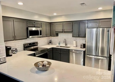 Beautifully updated 2 bedroom, 2 bath Quail Cove Townhome with on Rumbling Bald Resort on Lake Lure in North Carolina - for sale on GolfHomes.com, golf home, golf lot