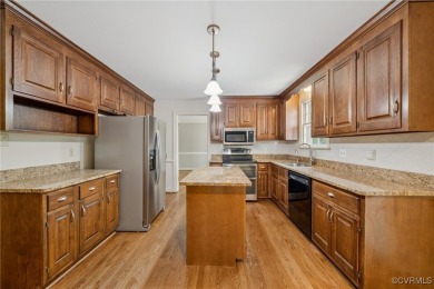 Situated on a wooded .71-acre lot in the heart of Midlothian on Salisbury Country Club in Virginia - for sale on GolfHomes.com, golf home, golf lot