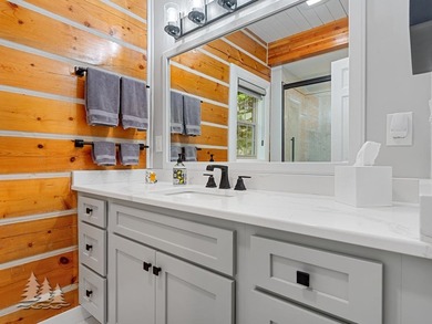 Tucked within the Garland Golf Resort, this beautifully updated on Garland Resort and Golf Club  in Michigan - for sale on GolfHomes.com, golf home, golf lot