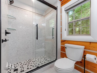 Tucked within the Garland Golf Resort, this beautifully updated on Garland Resort and Golf Club  in Michigan - for sale on GolfHomes.com, golf home, golf lot