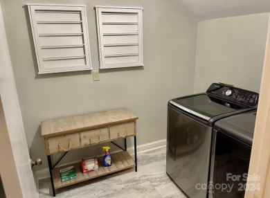 Beautifully updated 2 bedroom, 2 bath Quail Cove Townhome with on Rumbling Bald Resort on Lake Lure in North Carolina - for sale on GolfHomes.com, golf home, golf lot