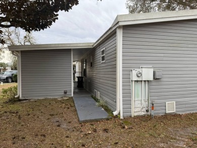 Beautifully Renovated 2-Bedroom, 2-Bath Double Wide Home in on Rolling Greens Executive Golf Community in Florida - for sale on GolfHomes.com, golf home, golf lot