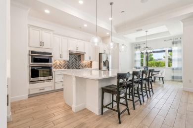 Sleek, smart, and solar-powered--this lavishly upgraded custom on Bent Pine Golf Club in Florida - for sale on GolfHomes.com, golf home, golf lot