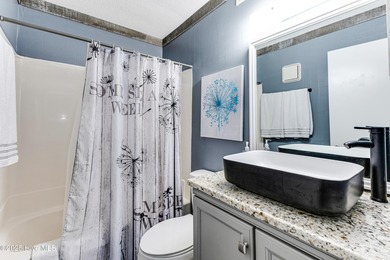 Stylish 2 bedroom, 2 bath condo in the heart of downtown on Carolina Shores Golf Course in North Carolina - for sale on GolfHomes.com, golf home, golf lot