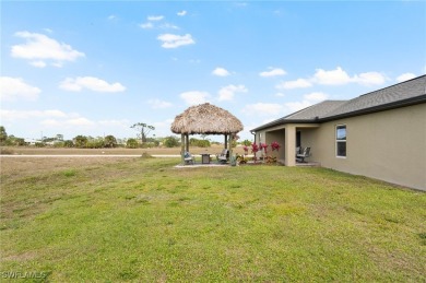 Escape the cold to the perfect SUNNY retreat in Northwest Cape on Burnt Store Golf Club in Florida - for sale on GolfHomes.com, golf home, golf lot