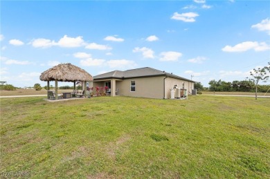 Escape the cold to the perfect SUNNY retreat in Northwest Cape on Burnt Store Golf Club in Florida - for sale on GolfHomes.com, golf home, golf lot