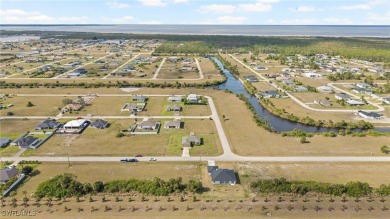Escape the cold to the perfect SUNNY retreat in Northwest Cape on Burnt Store Golf Club in Florida - for sale on GolfHomes.com, golf home, golf lot