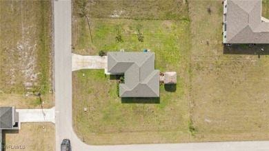 Escape the cold to the perfect SUNNY retreat in Northwest Cape on Burnt Store Golf Club in Florida - for sale on GolfHomes.com, golf home, golf lot