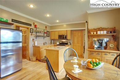 Sunset views, solar power, and space for everyone--this on Mountain Aire Golf Course in North Carolina - for sale on GolfHomes.com, golf home, golf lot