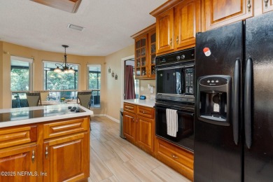 Nestled in a serene setting, this charming home offers a perfect on Blue Cypress Golf Club in Florida - for sale on GolfHomes.com, golf home, golf lot
