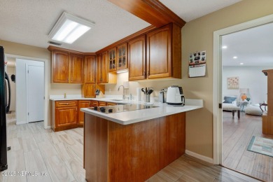 Nestled in a serene setting, this charming home offers a perfect on Blue Cypress Golf Club in Florida - for sale on GolfHomes.com, golf home, golf lot