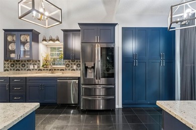 Tucked within the guard-gated community of Hunter's Green on Hunters Green Country Club in Florida - for sale on GolfHomes.com, golf home, golf lot