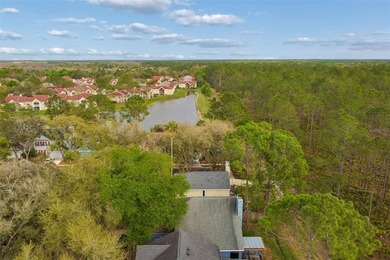 Tucked within the guard-gated community of Hunter's Green on Hunters Green Country Club in Florida - for sale on GolfHomes.com, golf home, golf lot