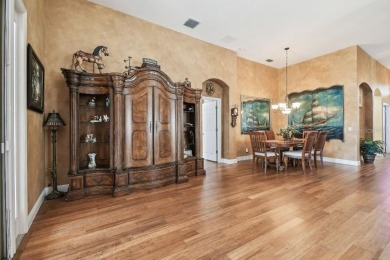 Stunning Former Model Home with Golf Course  Conservation Views on River Hills Country Club in Florida - for sale on GolfHomes.com, golf home, golf lot