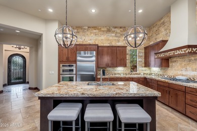 Sophisticated lock-and-leave living in an amenity-rich enclave on The Country Club At DC Ranch in Arizona - for sale on GolfHomes.com, golf home, golf lot