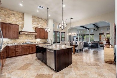 Sophisticated lock-and-leave living in an amenity-rich enclave on The Country Club At DC Ranch in Arizona - for sale on GolfHomes.com, golf home, golf lot