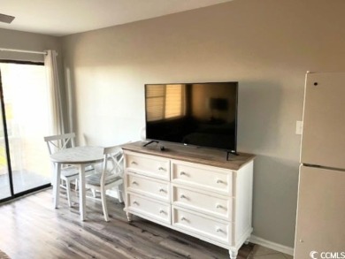Enjoy coastal living at NMB Golf & Tennis! This furnished NMB on Possum Trot Golf Course in South Carolina - for sale on GolfHomes.com, golf home, golf lot