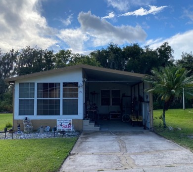 Spacious two bedroom two bath home with a bonus room just steps on Continental Country Club in Florida - for sale on GolfHomes.com, golf home, golf lot