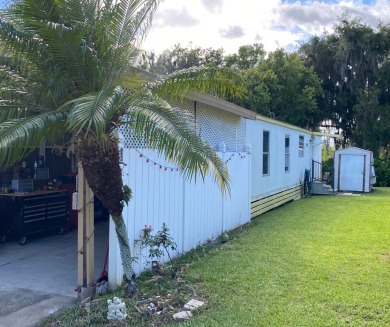 Spacious two bedroom two bath home with a bonus room just steps on Continental Country Club in Florida - for sale on GolfHomes.com, golf home, golf lot