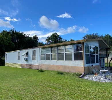 Spacious two bedroom two bath home with a bonus room just steps on Continental Country Club in Florida - for sale on GolfHomes.com, golf home, golf lot