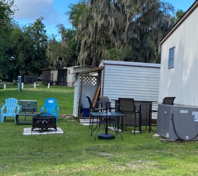 Spacious two bedroom two bath home with a bonus room just steps on Continental Country Club in Florida - for sale on GolfHomes.com, golf home, golf lot