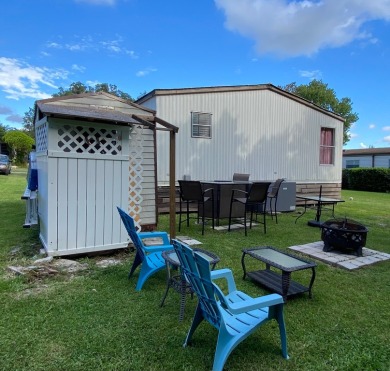 Spacious two bedroom two bath home with a bonus room just steps on Continental Country Club in Florida - for sale on GolfHomes.com, golf home, golf lot