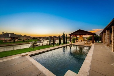 Stunning one story custom home that sits on the canal in The on The Golf Club at Resort Eagle Mountain Lake in Texas - for sale on GolfHomes.com, golf home, golf lot