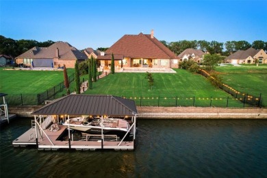 Stunning one story custom home that sits on the canal in The on The Golf Club at Resort Eagle Mountain Lake in Texas - for sale on GolfHomes.com, golf home, golf lot