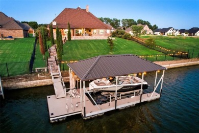 Stunning one story custom home that sits on the canal in The on The Golf Club at Resort Eagle Mountain Lake in Texas - for sale on GolfHomes.com, golf home, golf lot