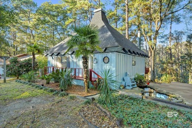 Welcome to your peaceful cottage in the woods, a private oasis on Lake Forest Yacht and Country Club in Alabama - for sale on GolfHomes.com, golf home, golf lot