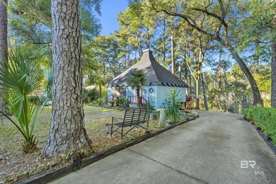 Welcome to your peaceful cottage in the woods, a private oasis on Lake Forest Yacht and Country Club in Alabama - for sale on GolfHomes.com, golf home, golf lot