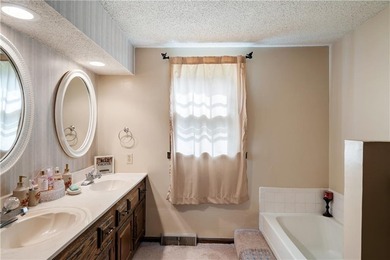 This spacious 4-bedroom residence offers exceptionally large on National Golf Club of Kansas City in Missouri - for sale on GolfHomes.com, golf home, golf lot