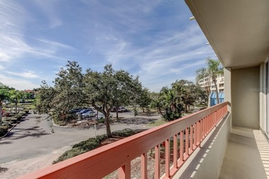 Discover this light-filled and spacious end-unit condo in the on Feather Sound Country Club in Florida - for sale on GolfHomes.com, golf home, golf lot