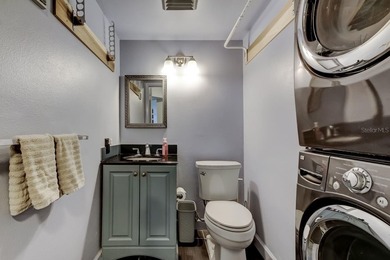 Discover this light-filled and spacious end-unit condo in the on Feather Sound Country Club in Florida - for sale on GolfHomes.com, golf home, golf lot