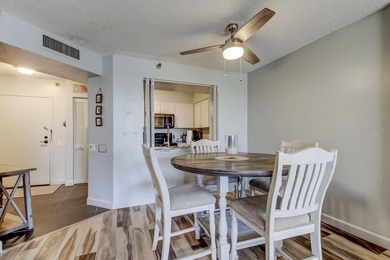 Discover this light-filled and spacious end-unit condo in the on Feather Sound Country Club in Florida - for sale on GolfHomes.com, golf home, golf lot