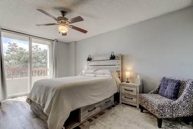 Discover this light-filled and spacious end-unit condo in the on Feather Sound Country Club in Florida - for sale on GolfHomes.com, golf home, golf lot