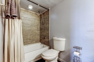 Discover this light-filled and spacious end-unit condo in the on Feather Sound Country Club in Florida - for sale on GolfHomes.com, golf home, golf lot