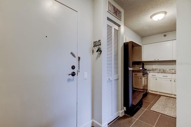 Discover this light-filled and spacious end-unit condo in the on Feather Sound Country Club in Florida - for sale on GolfHomes.com, golf home, golf lot
