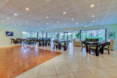 Discover this light-filled and spacious end-unit condo in the on Feather Sound Country Club in Florida - for sale on GolfHomes.com, golf home, golf lot