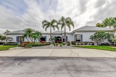 Discover this light-filled and spacious end-unit condo in the on Feather Sound Country Club in Florida - for sale on GolfHomes.com, golf home, golf lot